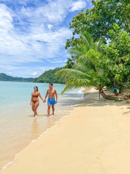 istock Couple Walking on a Tropical Beach 2179231481