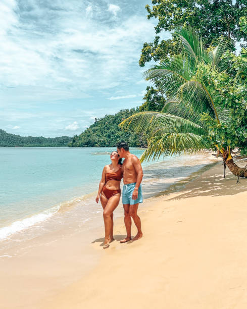 istock Couple Walking on a Tropical Beach 2179231484