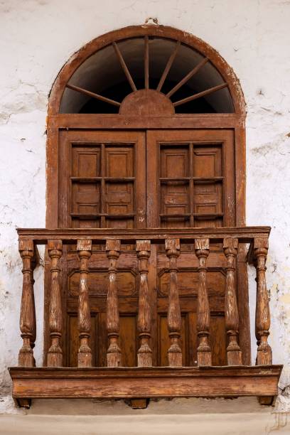 istock Rustic wooden balcony on aged wall. 2179234785