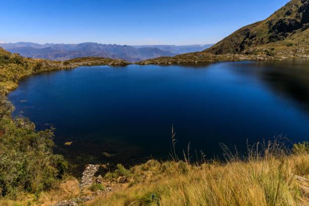 istock Serene mountain lake with clear blue water. 2179235837