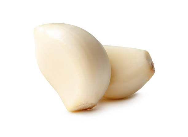 istock Side view of peeled garlic cloves in stack isolated on white background with clipping path 2179251620
