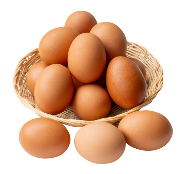 istock Top view of group of fresh brown chicken eggs in stack in wicker basket isolated on white background with clipping path 2179253470