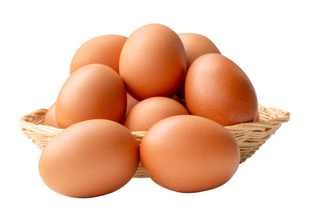 istock Group of fresh brown chicken eggs in stack in wicker basket isolated on white background with clipping path 2179253489