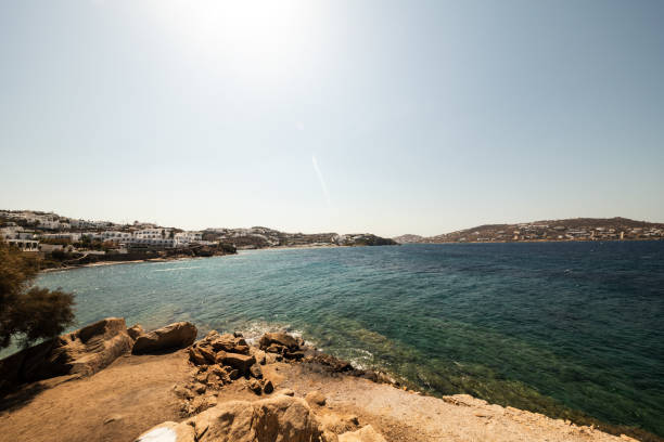 A view of the coastline of Mykonos as seen from behind the windmills on a beautiful summer day.