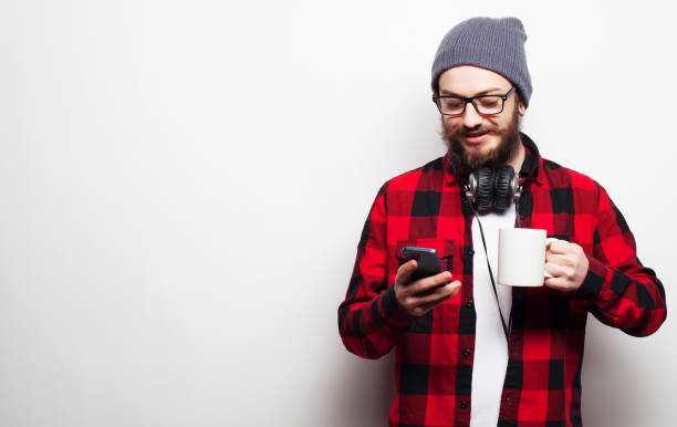 istock young bearded man with mobile phone 2179260480