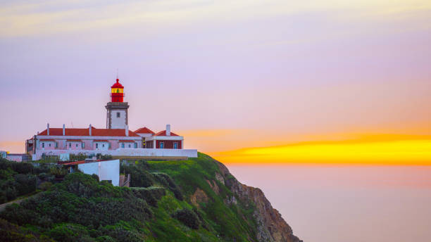 istock Scenic Lighthouse Overlooking the Ocean at Sunset 2179265096