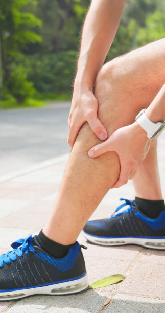istock asian man sporting calf cramping 2179277399