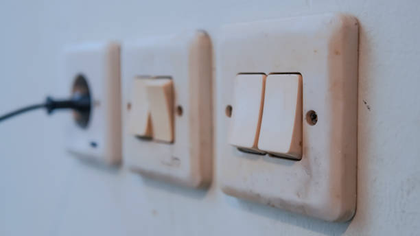 istock Three Light Switches Adorn the Wall 2179292864