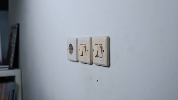 istock Three Light Switches Adorn the Wall 2179294126