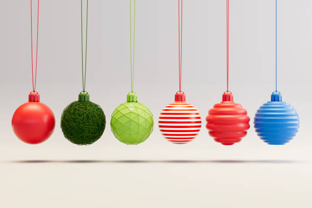 istock Christmas Ornaments on Gray Background with Newton's Cradle Style 2179302287