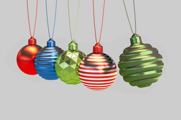 istock Christmas Ornaments on Gray Background with Newton's Cradle Style 2179302340