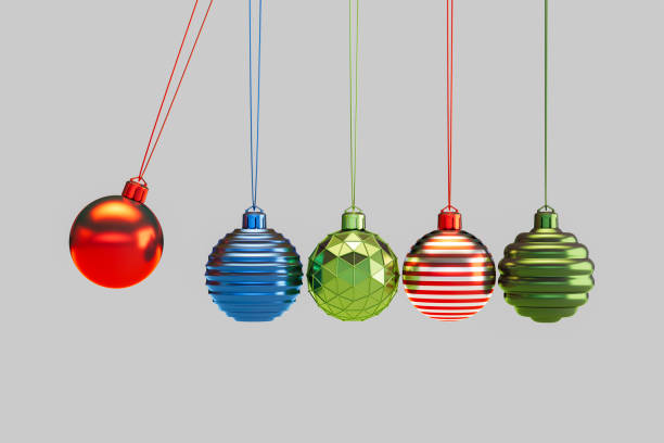 istock Christmas Ornaments on Gray Background with Newton's Cradle Style 2179302418