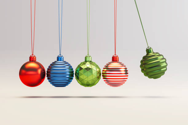 istock Christmas Ornaments on Gray Background with Newton's Cradle Style 2179302611