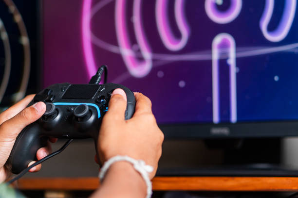 istock Gaming with Wireless Controller and Neon Wu-F Symbol 2179320613