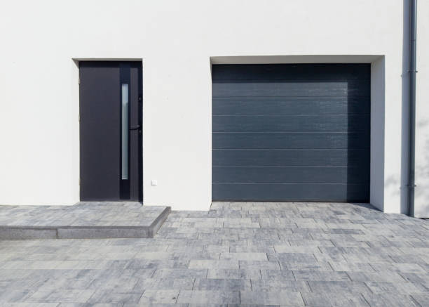 istock Modern garage with front door and paved entrance 2179321428