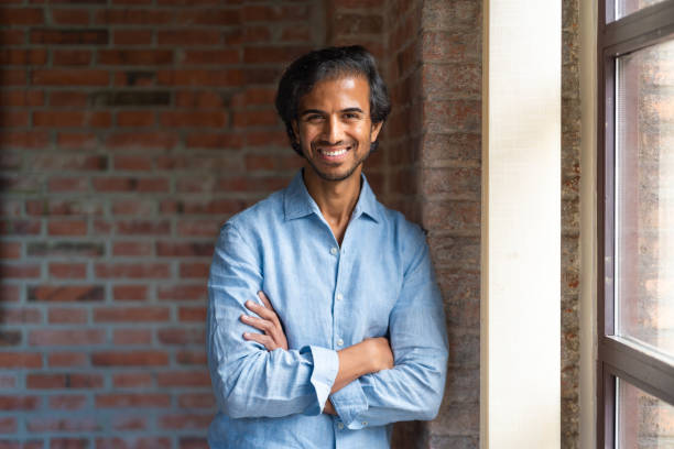 istock Confident indian male entrepreneur smiling with folded arms 2179322223
