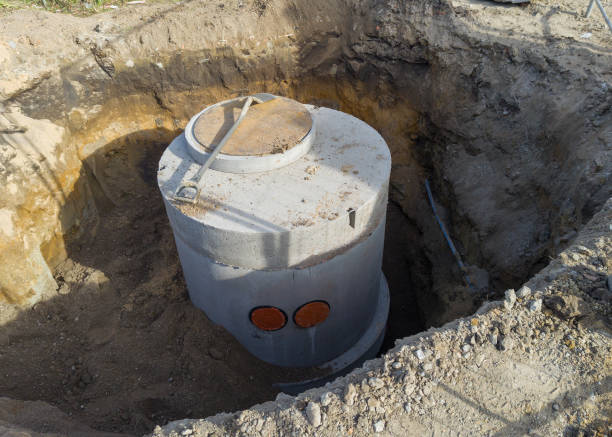 istock Concrete manhole installation in excavation site 2179324584