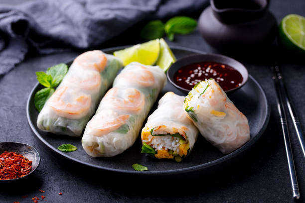 istock Vietnamese spring rolls with shrimps and vegetables with on a black plate. Dark background. Close u 2179329061