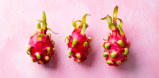 istock Asian exotic Dragon fruit, pitahaya. Pink background. Close up. Top view. 2179329883