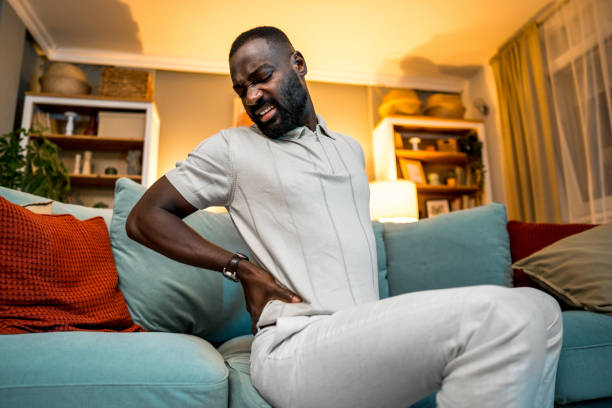 istock Young man suffering from back pain 2179332351