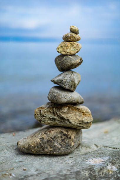istock A stack of rocks on a rock by the water 2179355666