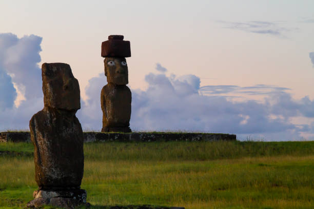 A beautiful landscape sunrise / sunset day over Ahu Tahai archeological complex in a summer day in Easter Island, Rapa Nui, Polynesia, Chile, Latin America.