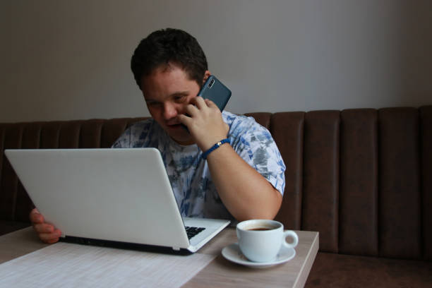 disability young man business using technology work job drink coffee