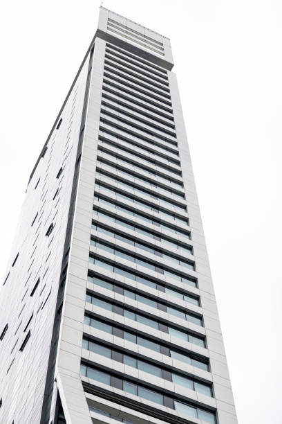 istock Low angle view of modern office building, skyscraper, white background with copy space 2179363262