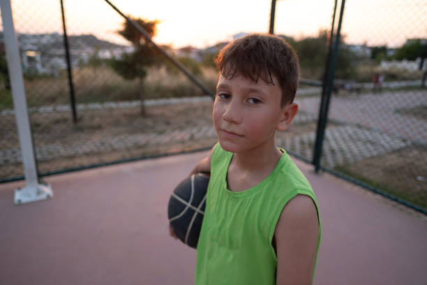 Little children playing basketball