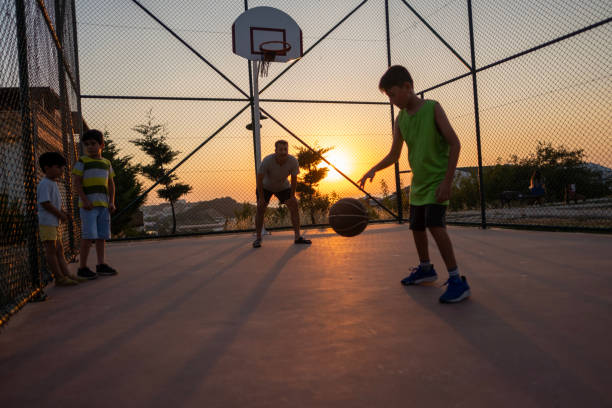 Little children playing basketball
