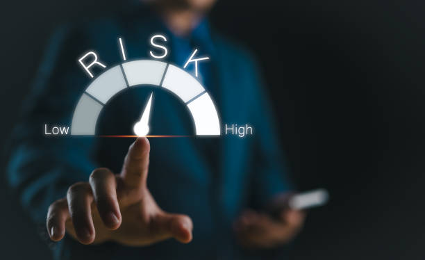 istock Risk management concept. Businessman touching risk level indicator virtual rating low to high for financial banking analysis and business. money risk assessment, Reducing project risk, invest strategy 2179409370