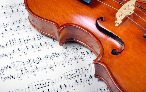 istock beautiful antique violin and notes 2179412581