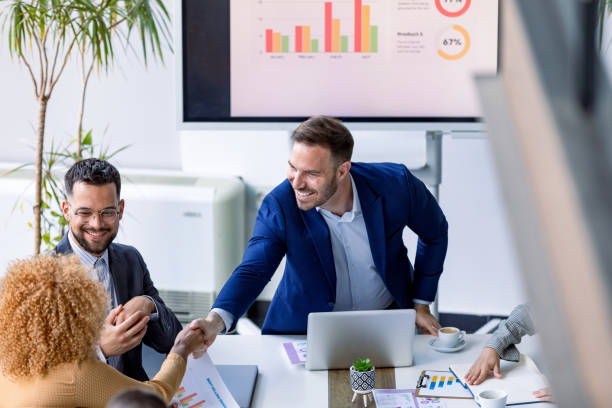 istock Colleagues sharing success with a congratulatory handshake. 2179413810