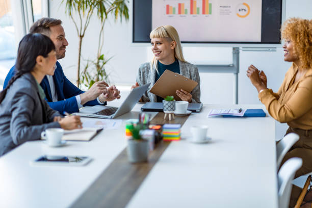 istock Business team discussing strategy in meeting room. 2179414078