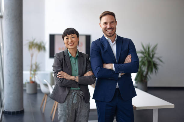 istock Successful business partners smiling in office 2179415133