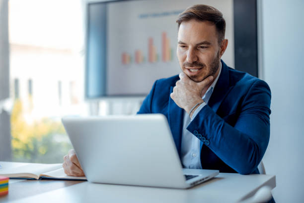 istock Businessman making decision at laptop in office. 2179415525