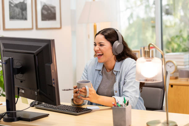 istock Young woman interacts with online classmates 2179416859