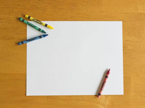 istock Children's favorite drawing tool, the crayon with white paper 2179421795