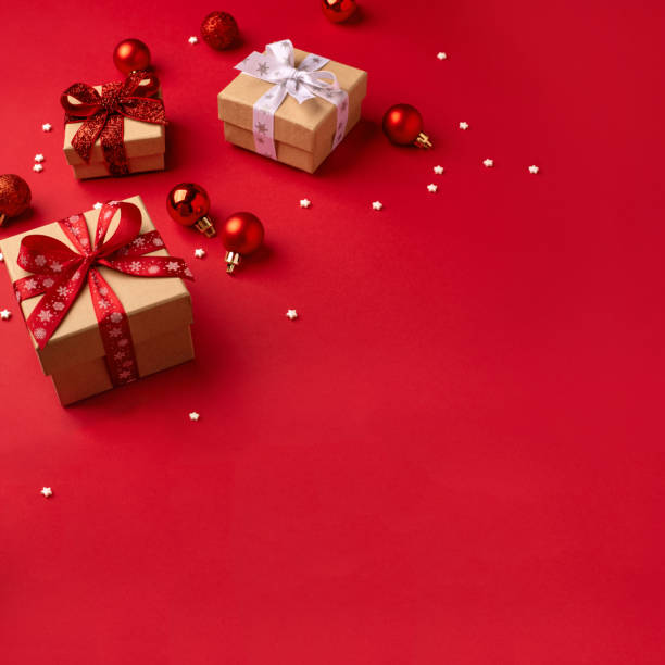 istock Christmas gift boxes with red balls. 2179427923