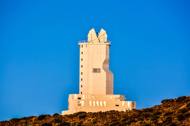 istock A tall white building with a blue sky in the background 2179430330