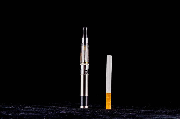 istock A cigarette and a vape are shown side by side 2179430393