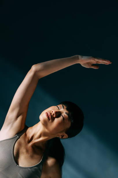 istock Serene Woman Practicing Calm Yoga Poses in Tranquil Atmosphere 2179438437