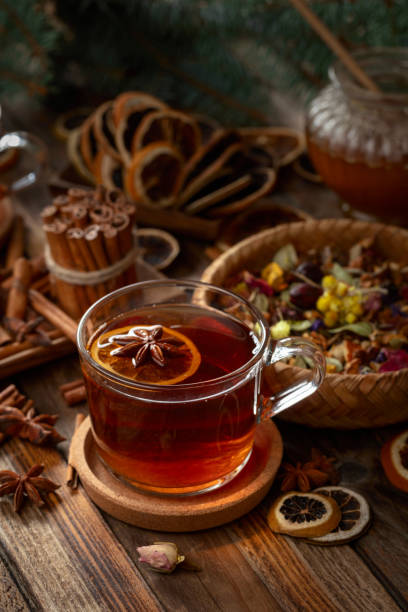 istock Christmas herbal tea with ingredients on a old wooden table. 2179444252