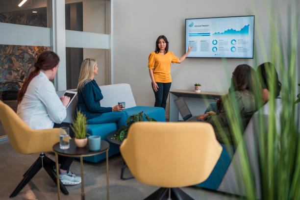 istock Hispanic Businesswoman Leads Office Presentation 2179470776
