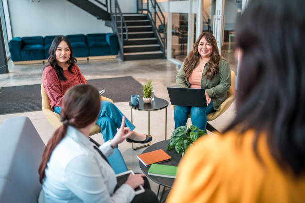 istock Diverse Businesswomen Engaged in Discussion at Modern Office 2179470789