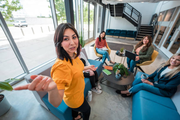 istock Hispanic Businesswoman Leads Presentation in Office Setting 2179470792