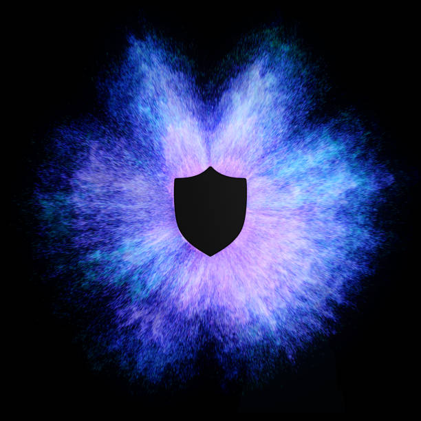 A black shield is surrounded by a vibrant explosion of purple and blue particles on a black background. The image symbolizes protection and strength, with the dynamic energy of the explosion suggesting a powerful force.