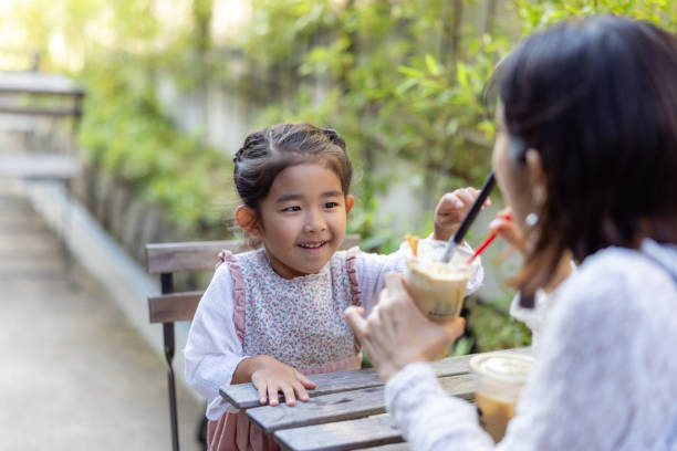 Family eating coffee float in traditional Japanese cafe