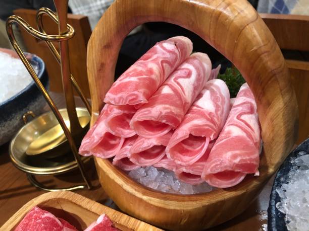 istock Mutton slices for hot pot, lamb, fat sheep, meat roll, wooden basket 2179485889