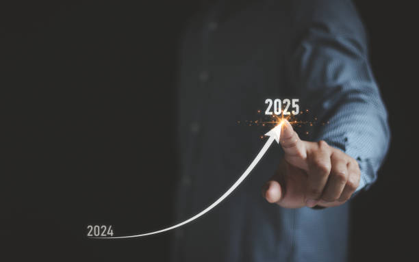 istock 2025 growth business concept. Businessman analyzing economic trend data for long-term investment in 2025. Set up objective target business cost and budget planning for the new year. 2179487639